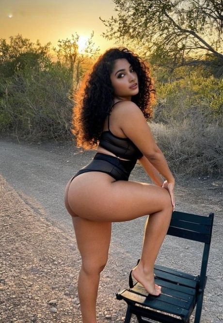 Curly-haired AI generated babe Makenna poses seductively on the road - #12
