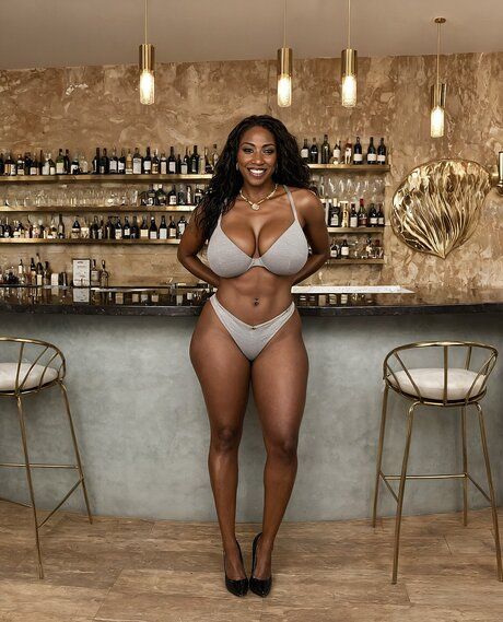 Hot black girl with perfect boobs undressing to pose in the nude at a bar - #1