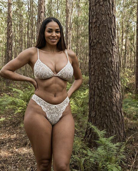 Curvy brunette removes her clothes to get naked in a forest environment - #3