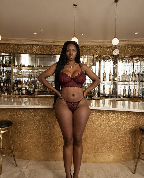 Pretty black girl models lingerie and clothes before standing naked at a bar - #4