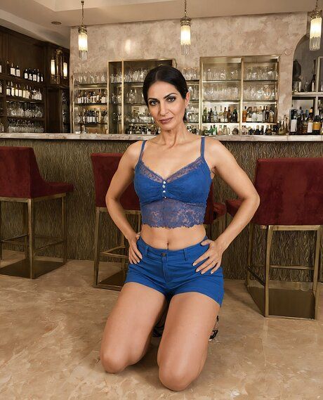 Older beauty with a flat chest removes her clothing to model in the nude - #8