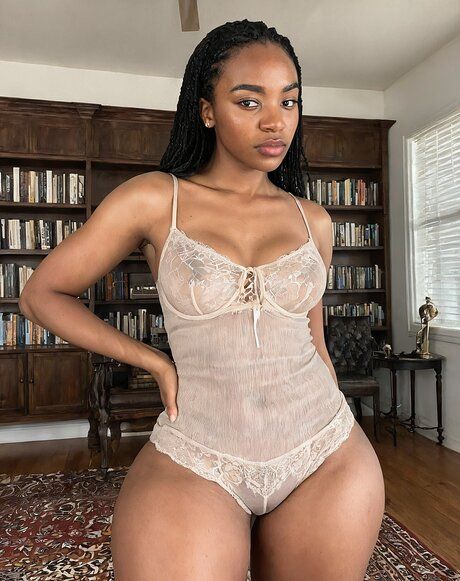 Curvy black girl gets completely naked in a library filled with books - #9