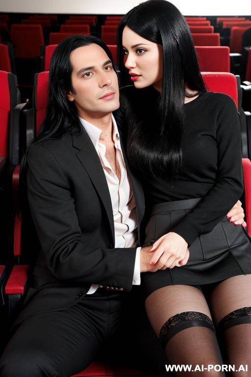 woman with long black hair in stockings and skirt sitting in the cinema next to a man in trousers. the man has his hand on her thigh and she is embarrassed - #main