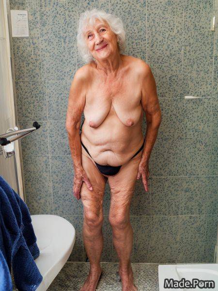 Thong babe nude looking at viewer standing photo saggy tits AI porn - made.porn on pornsimulated.com
