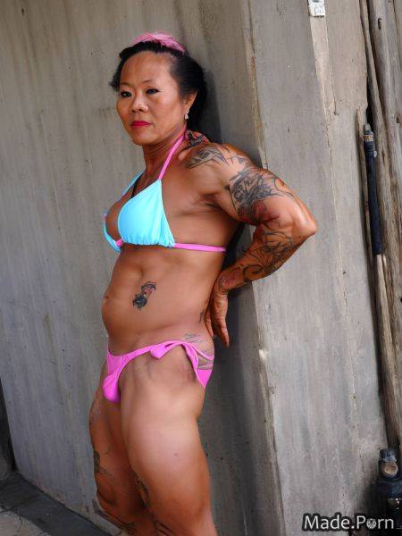 Tattoos bodybuilder top knot hair looking at viewer woman asian bikini AI porn - made.porn on pornsimulated.com